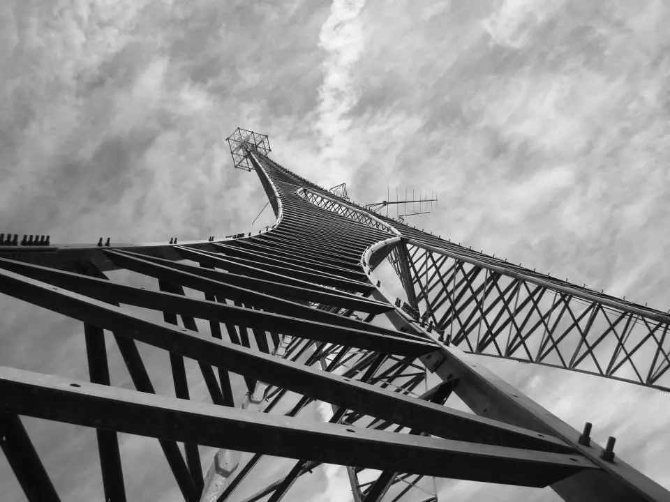 Looking up the lattice of a steel tower